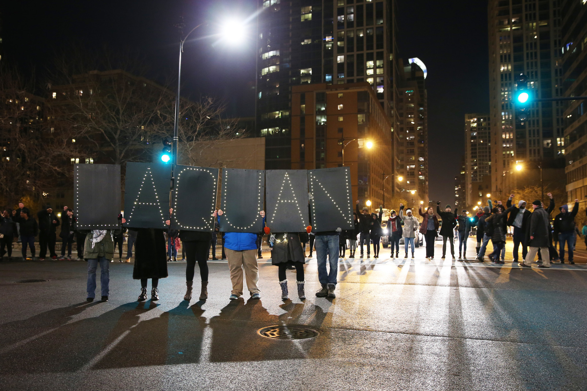 Protesters march on Nov. 24, 2015, after the city released...