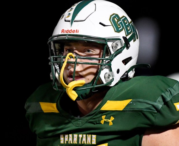 During the pregame warmups on the field, Glenbrook North's Samuel Cray Paich (70) watches New Trier on the other end of the field. Glenbrook North's football team hosted Central Suburban Conference South Division rival New Trier and were defeated 48-18 Thursday, Oct. 10, 2024. (Rob Dicker / for Pioneer Press)