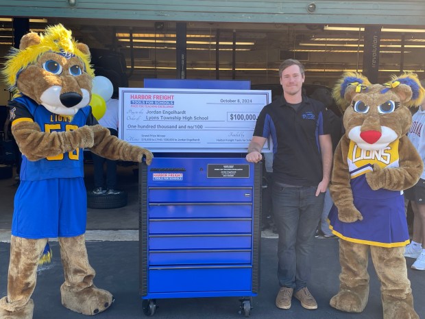 Lyons Township High School automotive teacher Jordan Engelhardt got a visit from VIPs including the school's mascots Tuesday when he was surprised with the Grand Prize awarded by the Harbor Freight Tools for Schools, which came with a toolbox and money for the school's automotive program. (Harbor Freight Tools for Schools)