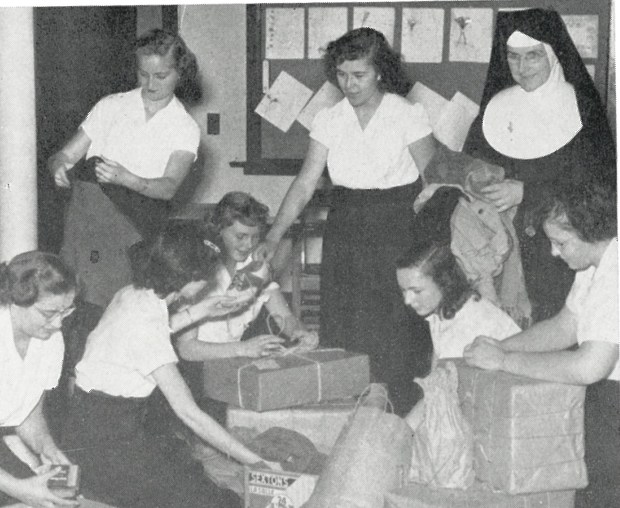 Students and staff at Nazareth Academy in La Grange Park package dry goods to be shipped to Europe for a relief effort in 1949 in this photo from the archives at the school, which is marking its 125th anniversary by continuing its long tradition of helping out. (Nazareth Academy)