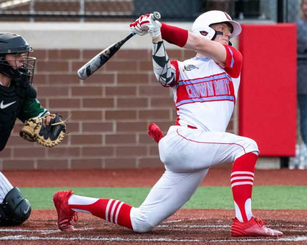 The Bulldogs' Noah Ehrlich connects for a RBI single in the sixth inning as Crown Point faced Illiana Christian Academy in Crown Point, Indiana Saturday May 4, 2024. (Andy Lavalley for the Post-Tribune)