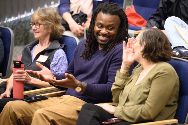 Decay Devils President Tyrell Anderson, center, speaks with other participants during the Calumet Heritage Conference on Saturday, Oct. 5, 2024. (Kyle Telechan/for the Post-Tribune)