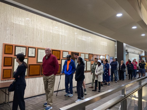 People waited in line Tuesday at the Lake County Government Center to cast their ballot on the first today of early voting. (Alexandra Kukulka/Post-Tribune)