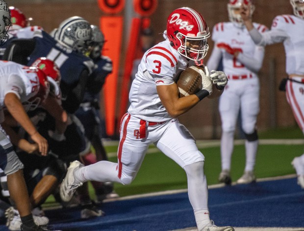 Crown Point's Larry Ellison runs in the ball for a touchdown during a game at Michigan City on Friday, Oct. 18, 2024. (Michael Gard/for the Post-Tribune)