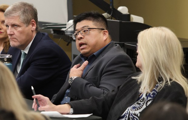 Panel member Yu Ouyang (center) English and World Languages and History, Philosophy, Politics and Economics Associated Department Chair asks a question during a pre-election discussion. The panel of Purdue Northwest experts broke down the pressing topics, challenges and decisions that could shape the future of our country on Monday, Oct. 21, 2024. (John Smierciak/for the Post Tribune)