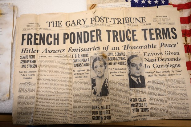 An issue of the Gary Post-Tribune from Friday, June 21, 1940 can be seen as items uncovered earlier this year during construction on the Good Fellow Lodge are displayed by Indiana Dunes National Park archaeology expert Judy Collins on Wednesday, Oct. 9, 2024. (Kyle Telechan/for the Post-Tribune)