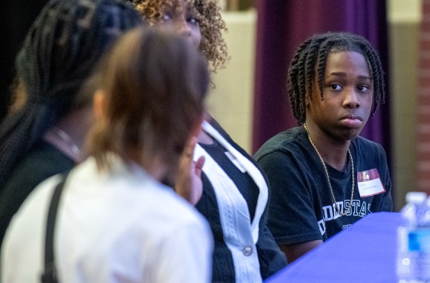 Schuyler Weaterspoon listens as fellow National Junior Honor Society members answer questions during the Youth Town Hall held at Clifford Pierce Middle School in Merrillville, Indiana Saturday Oct. 19, 2024. The event offered a unique opportunity for Pierce Students to engage with community leaders, parents and each other on issues affecting their future. (Andy Lavalley/for the Post-Tribune)