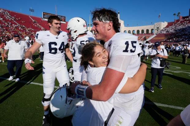 Penn State quarterback Drew Allar is hugged after an overtime win over USC on Saturday, Oct. 12, 2024, in Los Angeles. (AP Photo/Marcio Jose Sanchez)