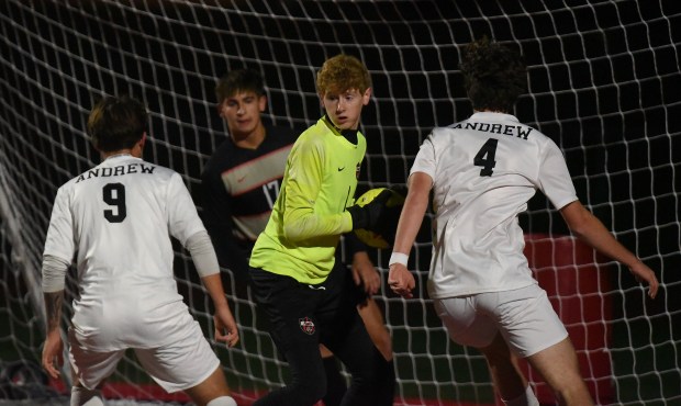 Lincoln-Way Central's Jimmy McKendry (1) grabs the ball between a pair of Andrew players during a SouthWest Suburban Conference game Wednesday, Oct. 16, 2024 in New Lenox, IL. (Steve Johnston/for the Daily Southtown)