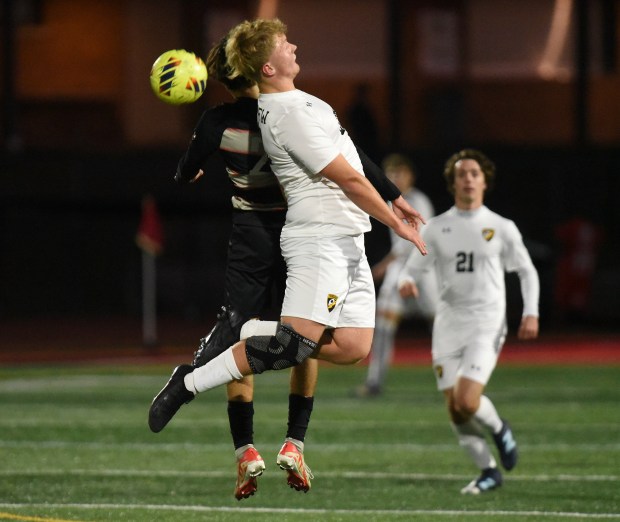 Lincoln-Way Central's Jackson Meyer (20) and Andrew's Erick Mietus (22) go up for the ball during a SouthWest Suburban Conference game Wednesday, Oct. 16, 2024 in New Lenox, IL. (Steve Johnston/for the Daily Southtown)