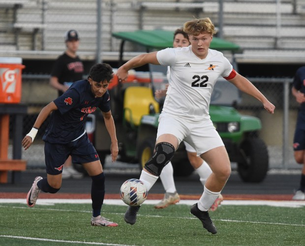 Andrew's Erick Mietus (22) clears the ball away from Stagg's Aayan Bhatti (7) during a SouthWest Suburban Conference game Thursday, Oct. 3, 2024 in Palos Hills, IL. (Steve Johnston / Daily Southtown)