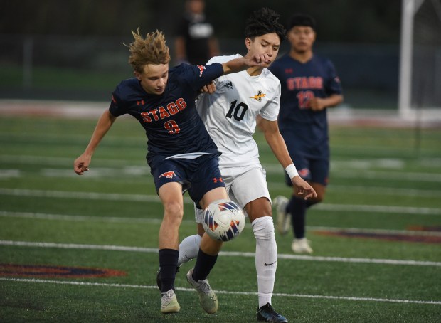 Stagg's Jacob Skupien (9) and Andrew's Caden Arguelles (10) battle for the ball during a SouthWest Suburban Conference game Thursday, Oct. 3, 2024 in Palos Hills, IL. (Steve Johnston / Daily Southtown)