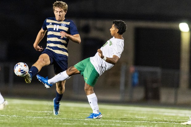 Lemont's Mitchell Sowa (11) gets to the ball a split-second sooner than Providence's Jovanny Gonzalez during the Class 2A Brother Rice Sectional semifinals in Chicago on Tuesday, Oct. 29, 2024. (Vincent D. Johnson / for the Daily Southtown)