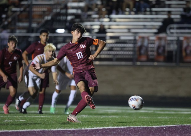 Brother Rice's Angelo Piech (10) kicks a penalty kick goal during the Class 2A Brother Rice Sectional semifinal at Brother Rice High School in Chicago on Wednesday, Oct. 30, 2024. (Talia Sprague / Daily Southtown)