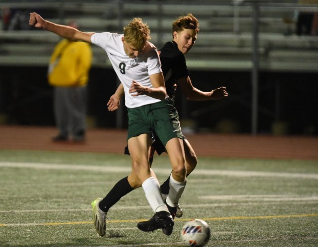 Lincoln-Way West's James Benefield (10) tries to defend Oak Lawn's Tristan Kramarz (9) as he scores his second goal of the game during the Class 3A Lockport Regional semifinals Wednesday, Oct. 23, 2024 in Lockport, IL. (Steve Johnston/for the Daily Southtown)