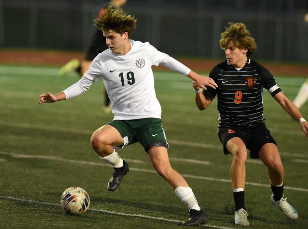 Oak Lawn's Dylan Walsh (19) works against Lincoln-Way West's Reece Eggener (9) during the Class 3A Lockport Regional semifinals Wednesday, Oct. 23, 2024 in Lockport, IL. (Steve Johnston/for the Daily Southtown)