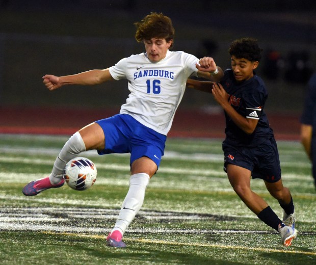 Sandburg's Mahdi Azabin (16) works against Stagg's Adrian Tavera (8) during the Class 3A Lincoln-Way Central Regional semifinals Tuesday, Oct. 22, 2024 in New Lenox, IL. (Steve Johnston/for the Daily Southtown)