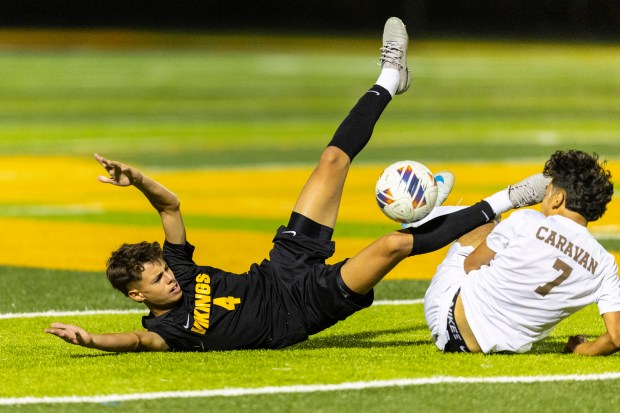 St. Laurence's Paul Rzadkosz (4) looks for a foul call after getting tangled up with Mount Carmel's Brandon Razo (7) during a Catholic League Blue game in Burbank on Tuesday, Oct. 1, 2024. (Vincent D. Johnson / Daily Southtown)