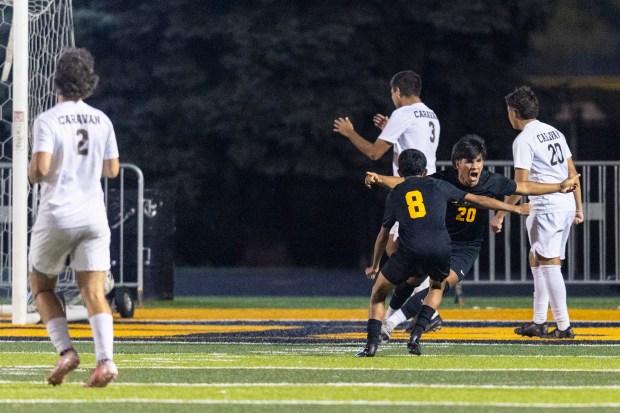 St. Laurence's Frankie Martinez (20) celebrates his goal in the 72 minute, giving the Vikings a 3-2 lead over Mount Carmel during a Catholic League Blue game in Burbank on Tuesday, Oct. 1, 2024. (Vincent D. Johnson / Daily Southtown)