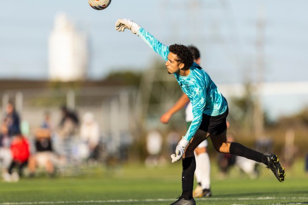 Oak Lawn's Giovanni Gonzalez (1) throws the ball back in play after a save against Reavis during a South Suburban Blue game in Burbank on Tuesday, Oct. 8, 2024. (Vincent D. Johnson / Daily Southtown)