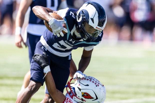 Reavis' Jorden Brown (2) pushes away an Eisenhower defender during a South Suburban Red game in Burbank on Saturday, Sept. 21, 2024. (Vincent D. Johnson / Daily Southtown)