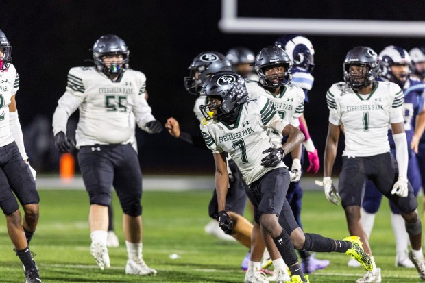 Evergreen Park's Arshawn Powell (7) sprints toward the sideline after picking off a Reavis pass with just over a minute left in a South Suburban Red game in Burbank on Thursday, Oct. 10, 2024. (Vincent D. Johnson / for The Daily Southtown)