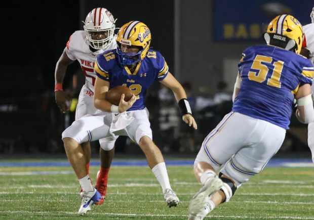 Sandburg's Anthony Shelton (12) runs the ball against Homewood-Flossmoor during a non conference game in Orland Park on Friday, Sept. 13, 2024. (Troy Stolt / Daily Southtown)