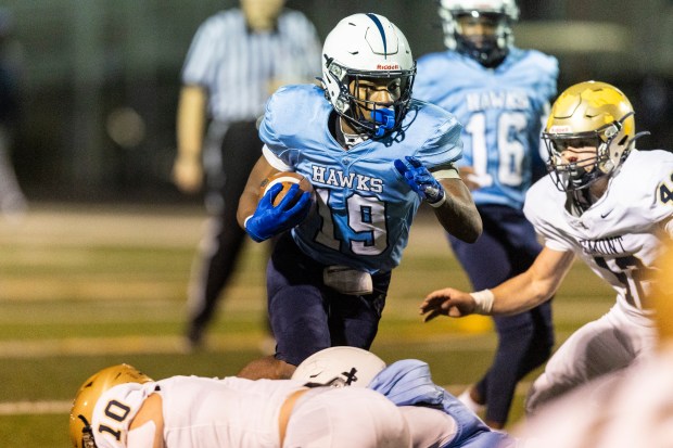 Hillcrest's Erimus Wright (19) finds a gap in the Lemont defense during a South Suburban Blue game in Country Club Hills on Thursday, Oct. 24, 2024. (Vincent D. Johnson / for the Daily Southtown)