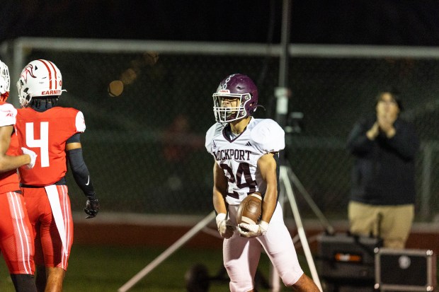 Lockport's Chris Miller (24) celebrates after his touchdown run put the Porters on the board against Homewood-Flossmoor during a Southwest Valley Blue game in Flossmoor on Friday, Oct. 25, 2024. (Vincent D. Johnson / for the Daily Southtown)