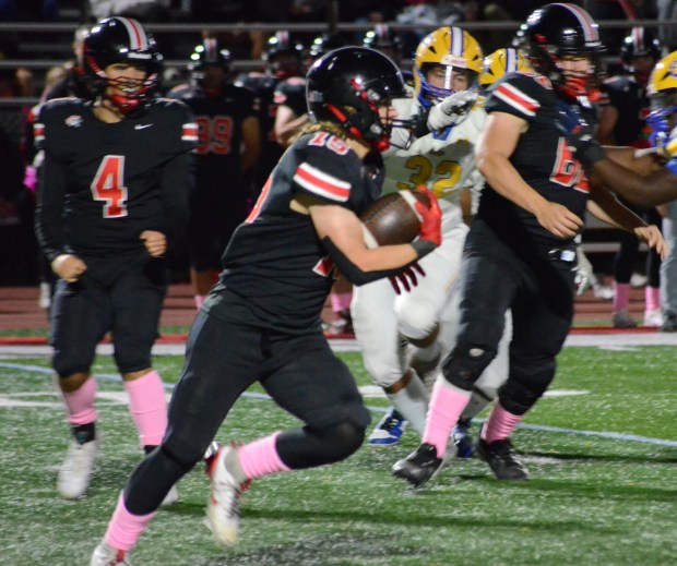 Lincoln-Way Central's Tyler Tulk carries the ball against Sandburg during a Southwest Valley Conference crossover game in New Lenox on Friday, Oct. 4, 2024. (Jeff Vorva / Daily Southtown)