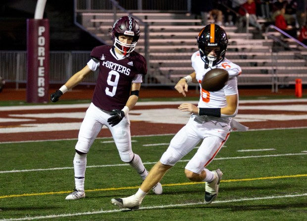 Lockport's Adam Kozak (9) runs toward the ball around Lincoln-Way West's Quinn Forsythe (6) during a game at Lockport Township High School in Lockport, IL, on Friday, Oct. 16, 2024. (Nate Swanson / for the Daily Southtown)