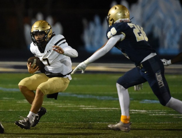 Richards' Noah Escobedo (7) scrambles for yards against Lemont during a South Suburban Conference game Friday, Oct. 11, 2024 in Lemont, IL. (Steve Johnston/for the Daily Southtown)