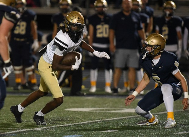 Richards' Milan Mosley (1) picks up yards after his catch against Lemont during a South Suburban Conference game Friday, Oct. 11, 2024 in Lemont, IL. (Steve Johnston/for the Daily Southtown)