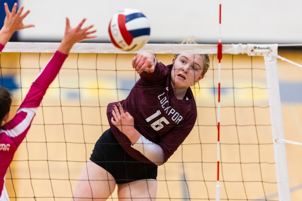 Lockport's Quinn HIgham (16) powers the ball past a Sandburg blocker during a Southwest Suburban Conference game in Orland Park on Thursday, Oct. 3, 2024. (Vincent D. Johnson / Daily Southtown)