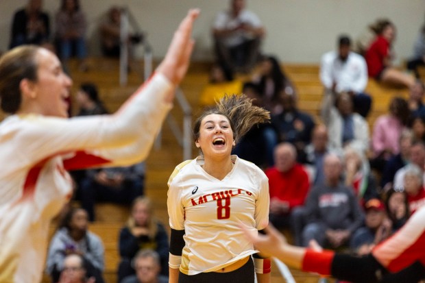 Mother McAuley's Peyton Heatherly (8) and her teammates celebrates after a point against Lyons Township during a nonconference game in Chicago on Wednesday, Oct. 23, 2024. (Vincent D. Johnson / for the Daily Southtown)