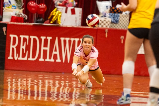 Marist's Molly Boyle dives for a ball against Marian Catholic during a nonconference game in Chicago on Tuesday, Oct. 22, 2024. (Vincent D. Johnson / for the Daily Southtown)