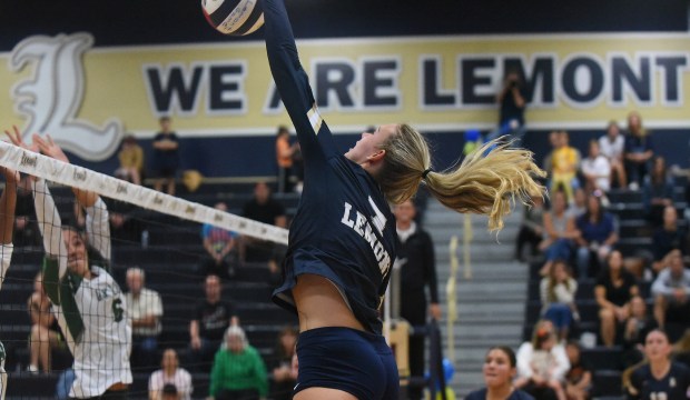 Lemont's April Rice (7) follows through on a kill against Oak Lawn during a South Suburban Conference match Tuesday, Oct. 1, 2024 in Lemont, IL. (Steve Johnston / Daily Southtown)