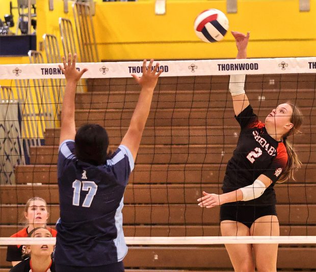 Shepard's Jenna Powers (2) puts a shot over the head of Reavis's Quetzalli Pichardo Aich (17) during the Class 4A Thornwood Regional volleyball semifinals on Tuesday, Oct. 29, 2024. (John Smierciak / Daily Southtown)