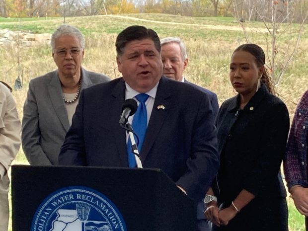 Gov. J.B. Pritzker talks Oct. 31, 2024, at an event marking the halfway point of completing a flood control project in Robbins. (Mike Nolan / Daily Southtown)