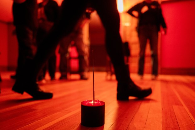 A REM-Pod device, used to detect electromagnetic fields and temperature for ghost investigations, sits on the floor while guests participate in a paranormal investigation Oct. 25, 2024, at the Pleasant Home mansion in Oak Park. (Vincent Alban/for the Chicago Tribune)