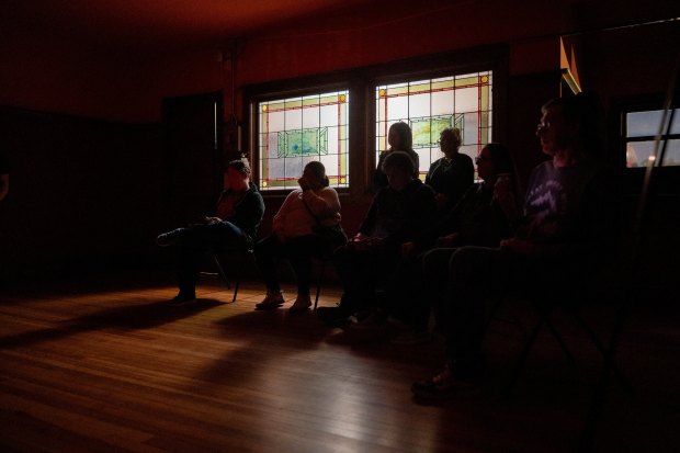 Guests participate in a paranormal investigation hosted by Other Side Investigations Oct. 25, 2024, at the Pleasant Home mansion in Oak Park. (Vincent Alban/for the Chicago Tribune)