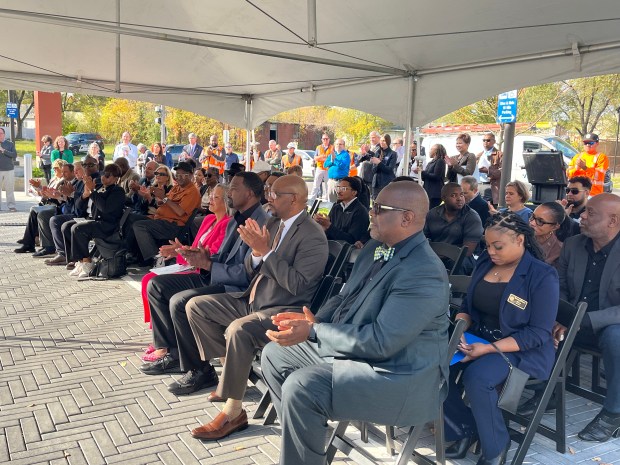 Attendees clap for speakers at the ribbon cutting ceremony Oct. 29, 2024, celebrating the reopening of the 147th Street/Sibley Boulevard Metra station in Harvey. (Samantha Moilanen/Daily Southtown)