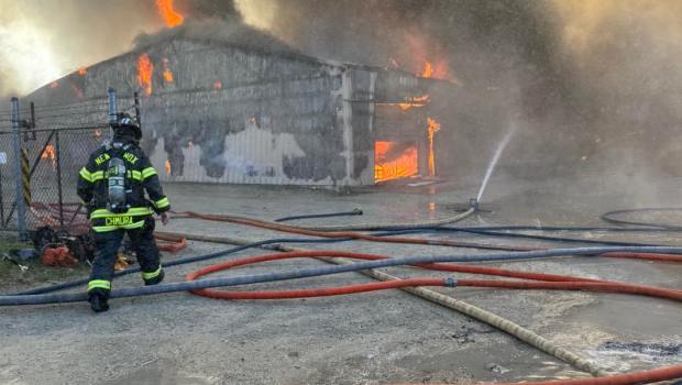 Crews work to extinguish a large fire at Tri-Star Cabinet and Top Company in New Lenox, Oct. 17, 2024. (New Lenox Fire Protection District)