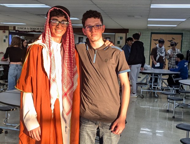 Muhammad Abuelhawa and Mohammad Khaddash, both sophomores, prepare to participate in the recent Oak Lawn Community High School Community Outreach event. Abuelhawa performed in the fashion show and Khaddash, president of the school's Arabic Honor Society, was a host at the event. (Janice Neumann/Daily Southtown)