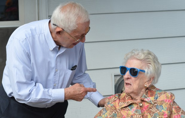 Homewood Mayor Richard Hofeld talks with 110-year-old Mary Cantway during a celebration of her birthday Monday at her house in Homewood. (Jeff Vorva/Daily Southtown)