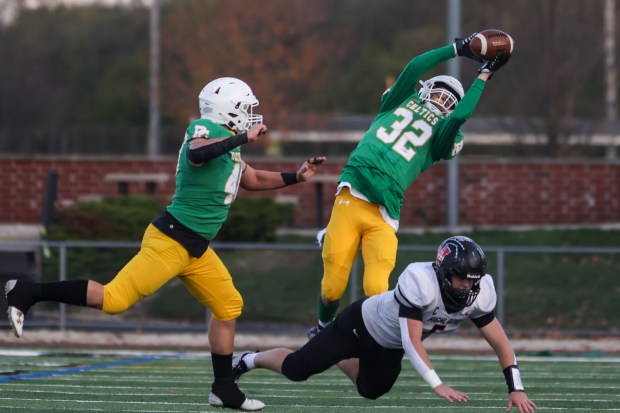 Providence's Gavin Hagan (32) goes up for an interception that was called back against Highland during a Class 5A state quarterfinal game in New Lenox on Saturday, Nov. 11, 2023.