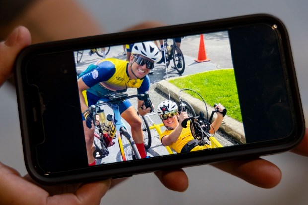 A 2022 photo shows Kevin McDowell, left, and Megan Sporny during the five-day, four-state CUREage Bike Ride to raise funds for pediatric cancer research. (Brian Cassella/Chicago Tribune)