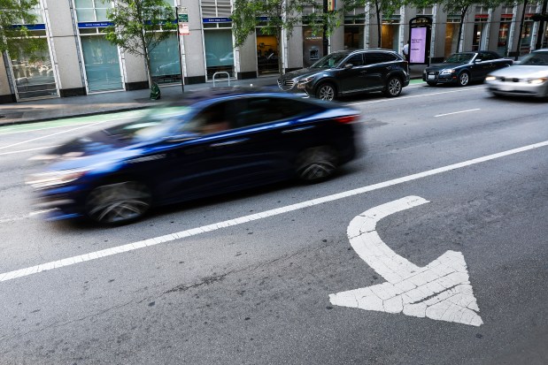 A car travels along West Randolph Street in Chicago's Loop in 2020. (José M. Osorio/Chicago Tribune)