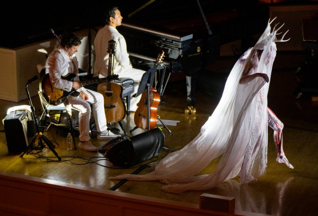 A dancer enters the stage before a performance by Anohni and the Johnsons at the Chicago Symphony Center on Oct. 12, 2024. (Vincent Alban/for the Chicago Tribune)