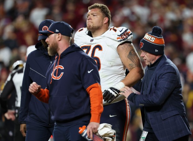 Bears guard Teven Jenkins walks off with an injury in the fourth quarter on Oct. 27, 2024. (Brian Cassella/Chicago Tribune)